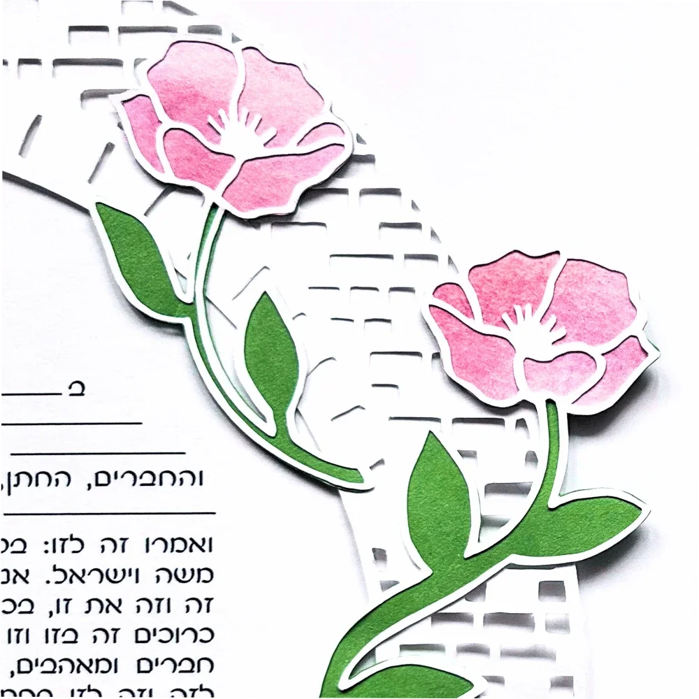 close up of inlaid watercolor flowers  on papercut ketubah