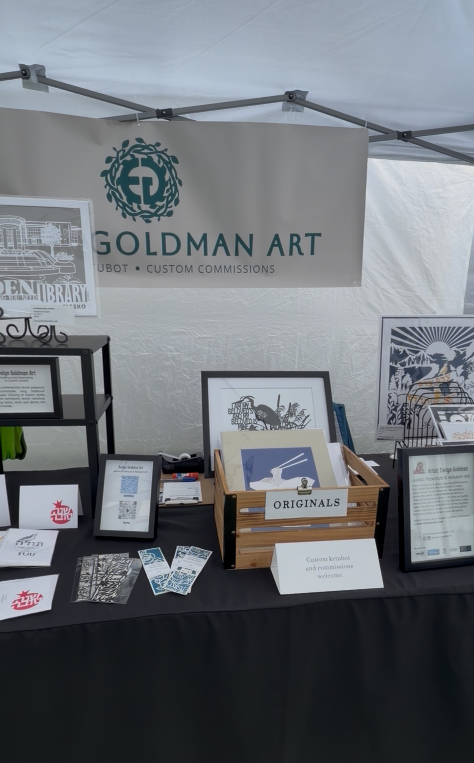 The interior of EG Art's booth at an art fair