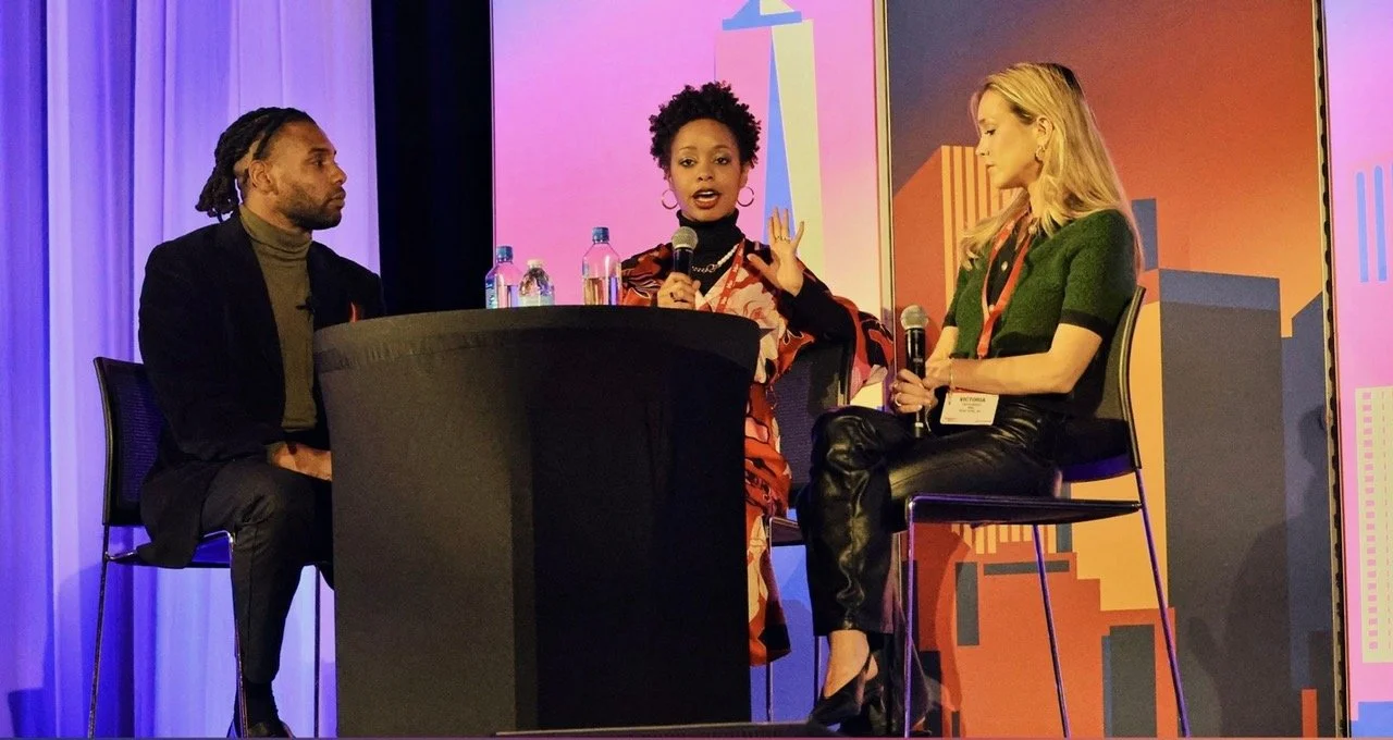Keenan Medlock moderating a live panel discussion with two guests.
