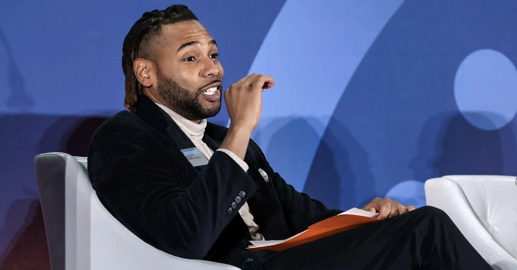 Keenan Medlock speaking during a live event conversation.