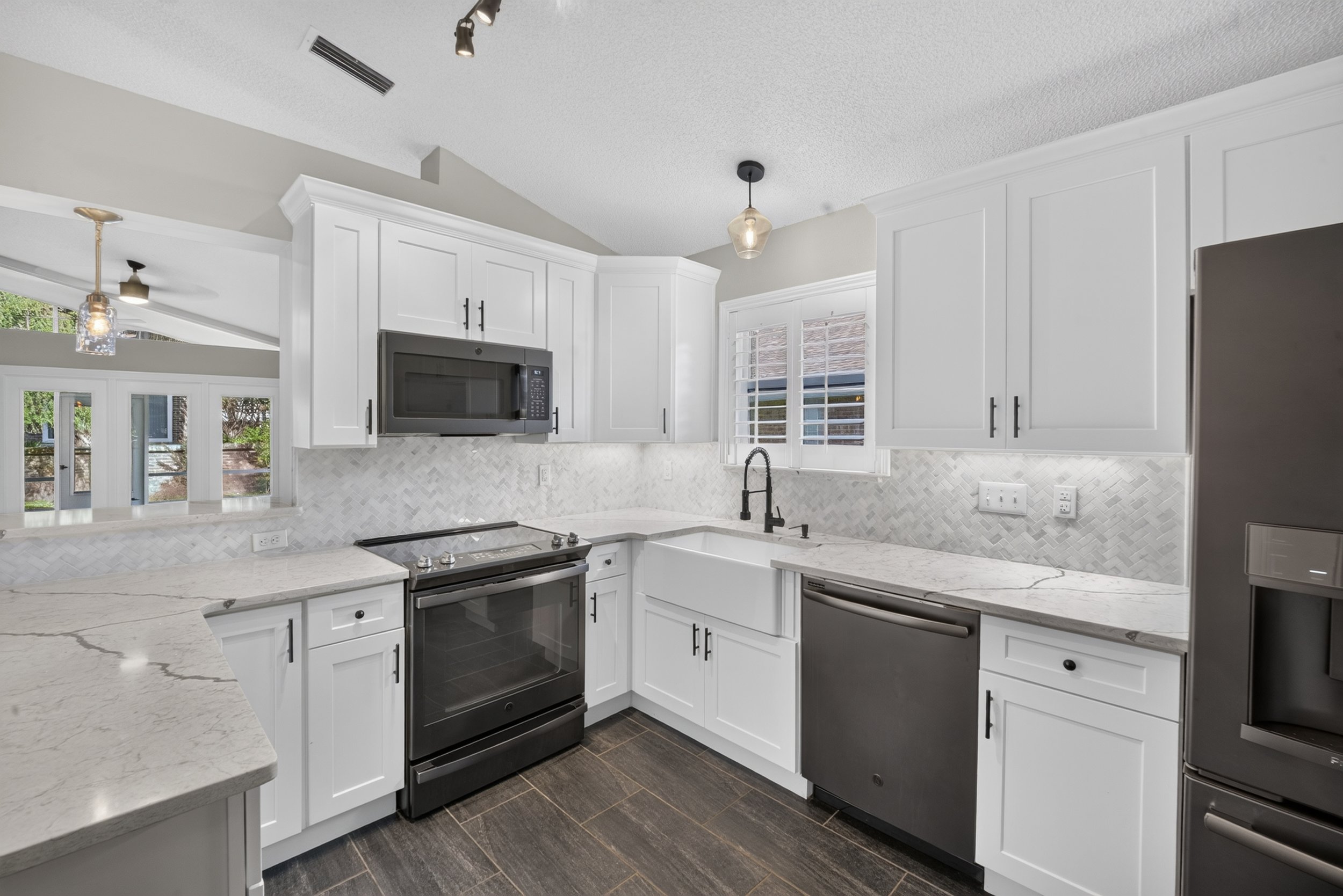 Luxury real estate photography of a modern kitchen in Orlando, Florida by Palm & Key Media