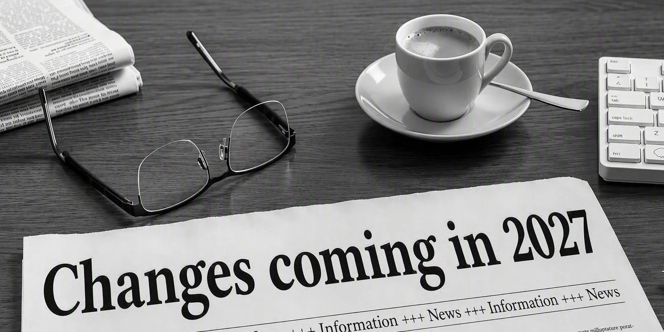 Newspaper headline reading Changes coming in 2027, beside glasses and a coffee