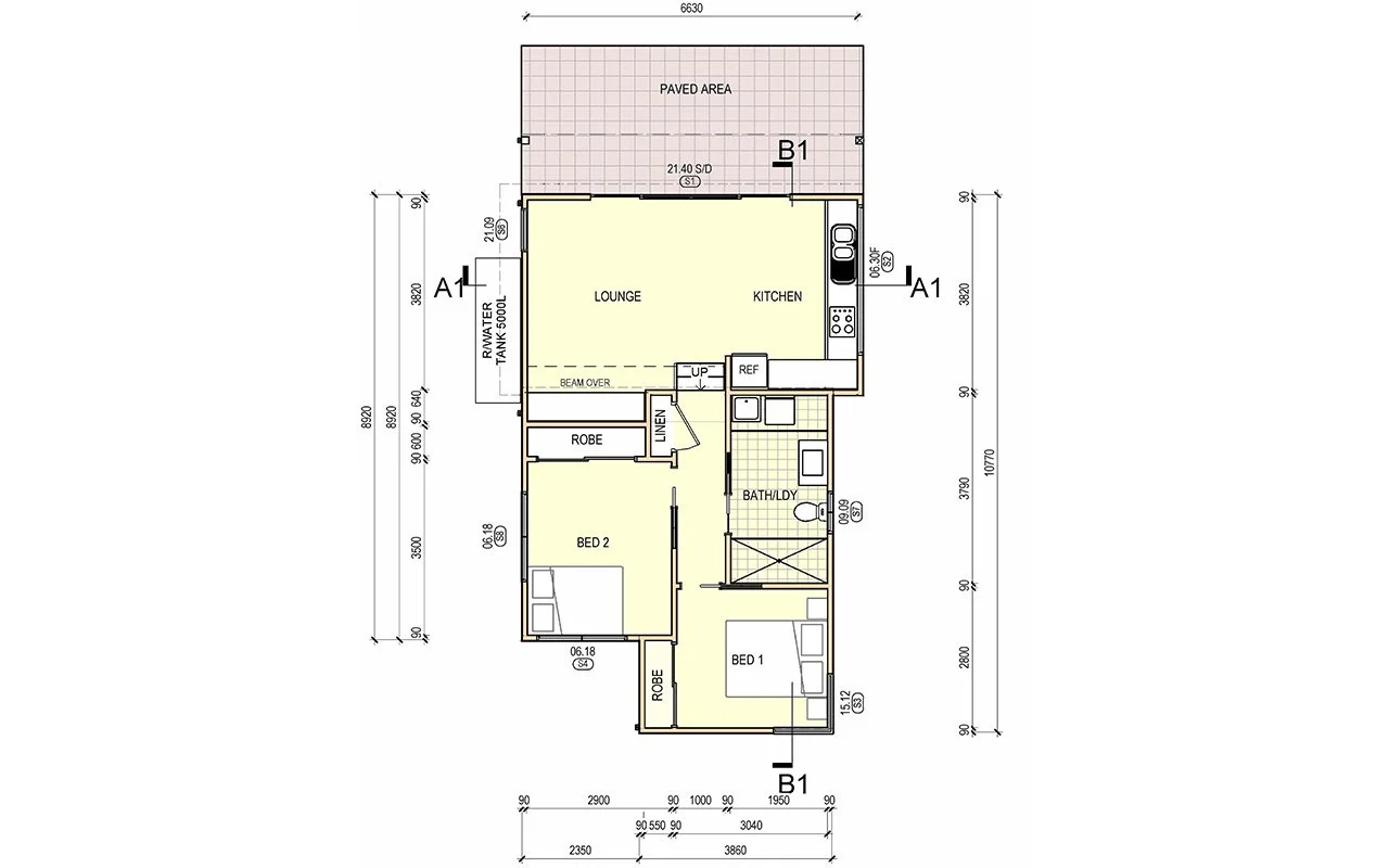 Floor plan of a house showing a patio, lounge, kitchen, two bedrooms, a bathroom combined with laundry, and various storage areas.
