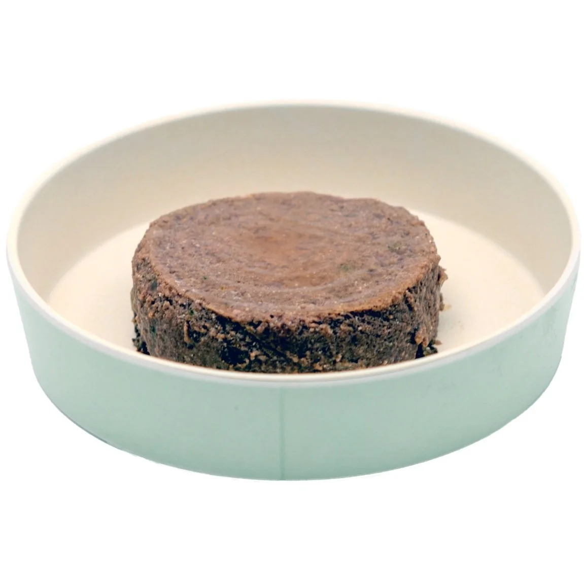 A piece of cooked brown meat on a white plate