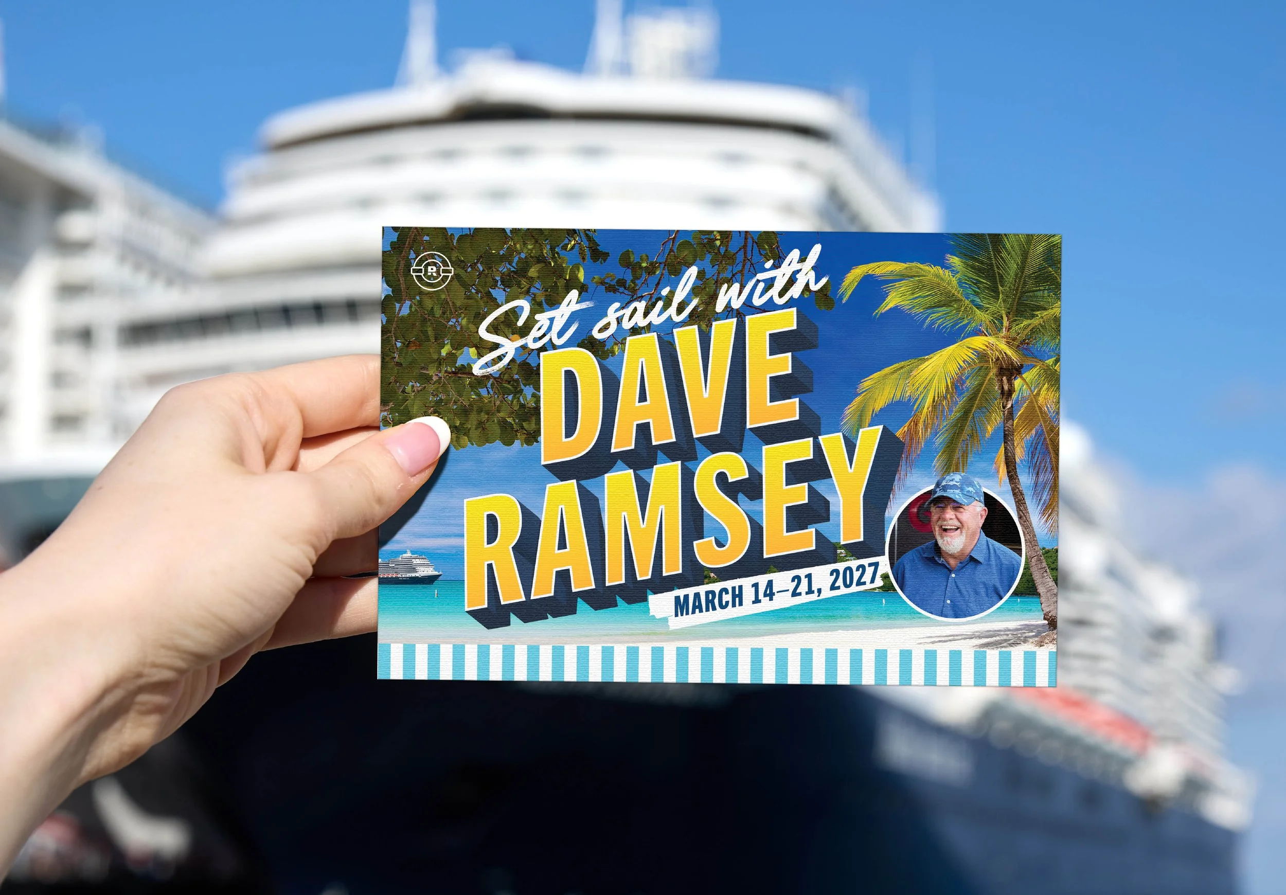 Hand holding a colorful event postcard for Dave Ramsey, with palm trees, ocean, cruise ship, and a smiling man on it, in front of a large white cruise ship and a clear blue sky.