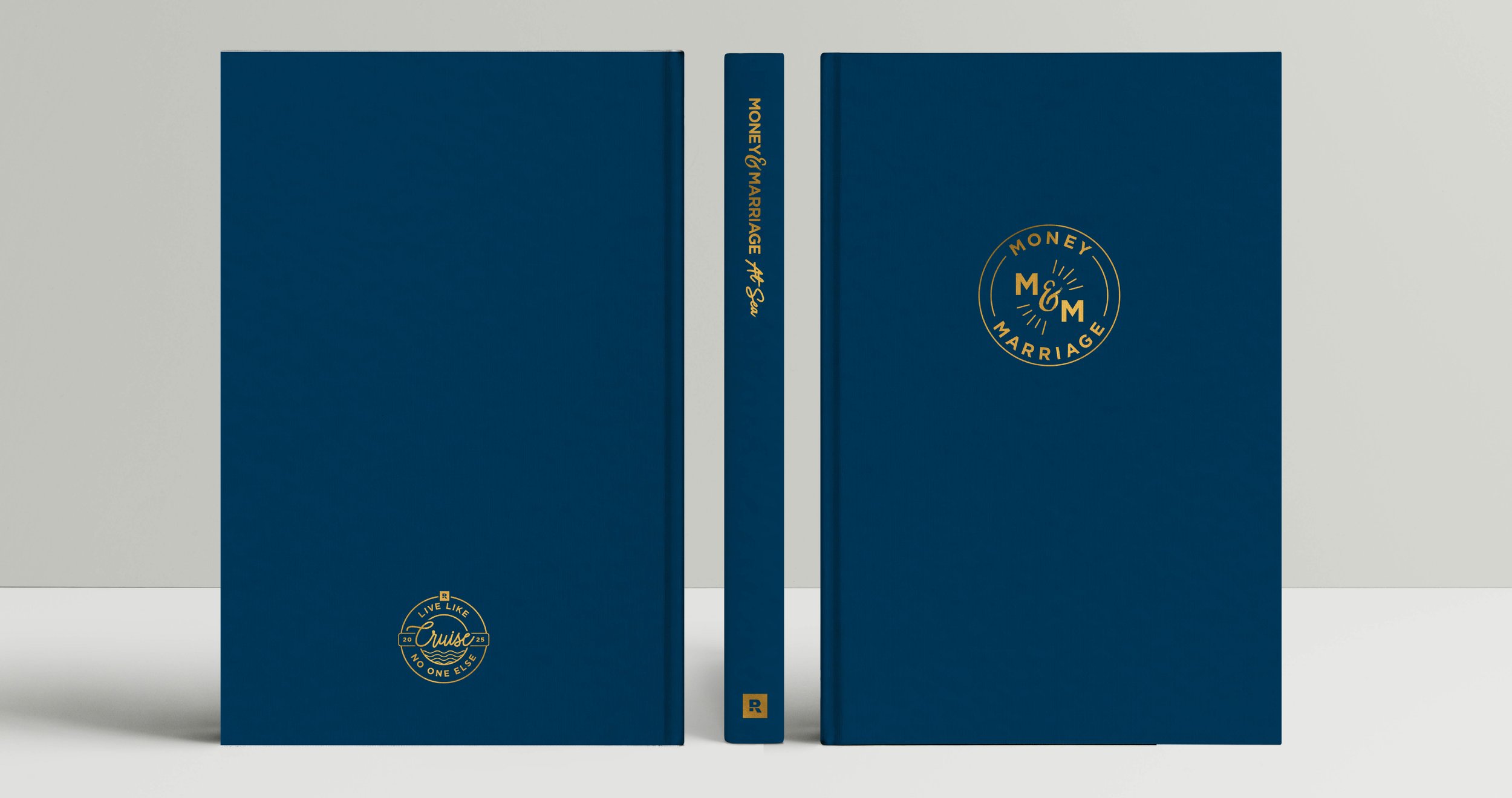 The front, back, and spine for a themed event journal. The navy blue notebook has gold foil of the cruise and company logo.