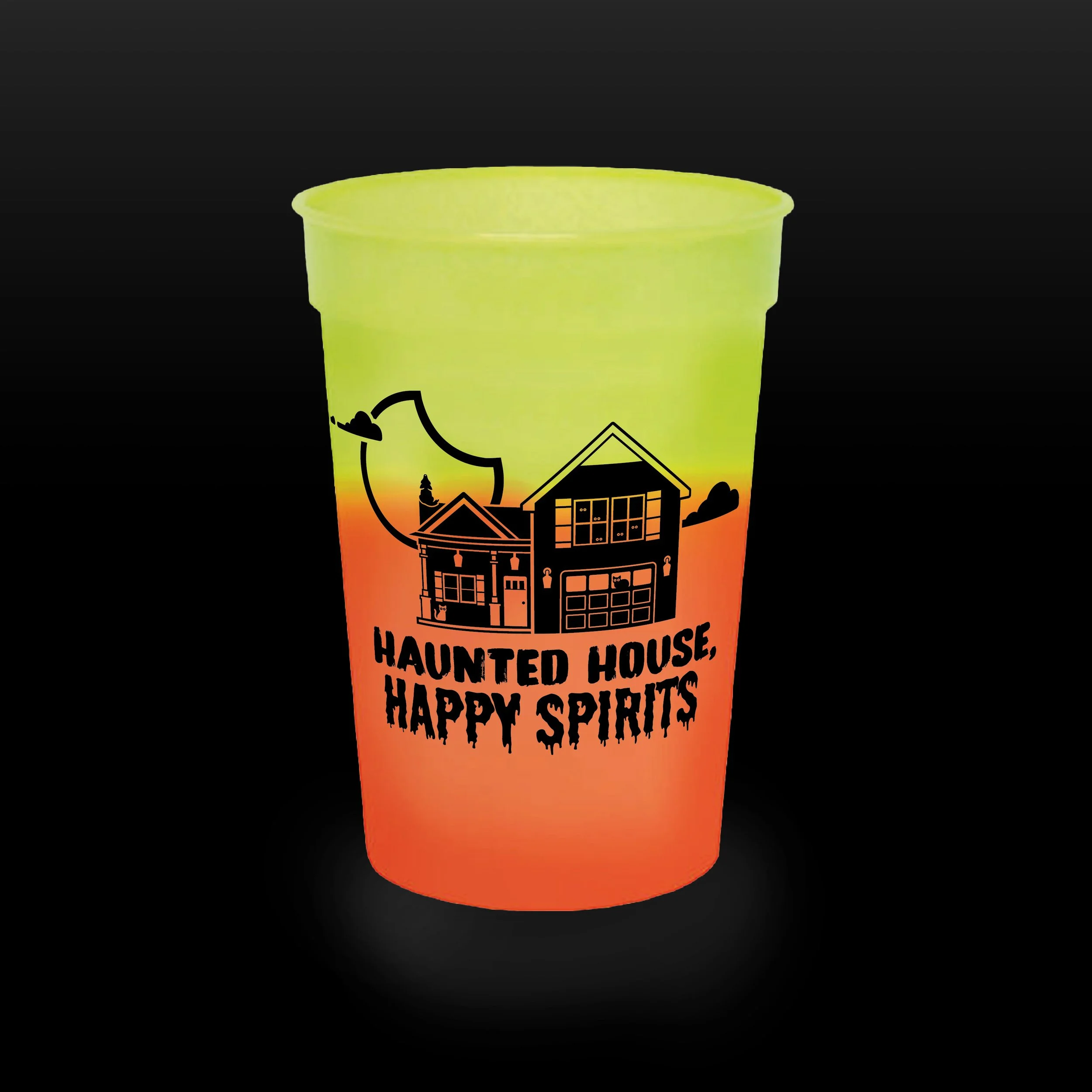 A gradient-colored cup featuring a Halloween-themed haunted house illustration with the text 'Haunted House, Happy Spirits' on it.