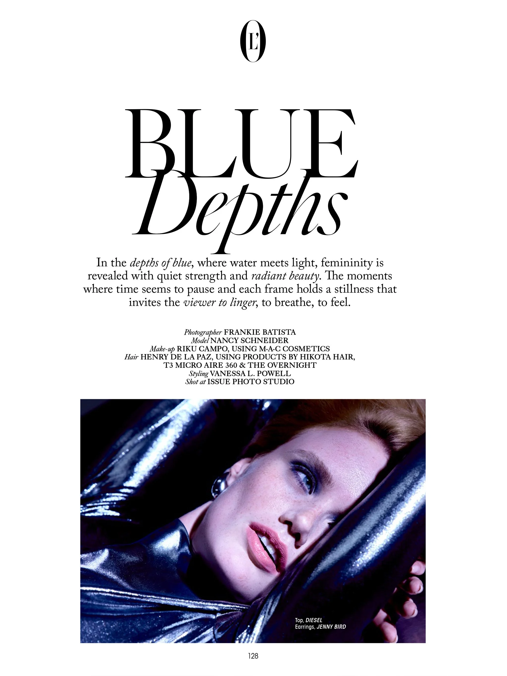 A woman with fair skin, red lipstick, and hoop earrings lying on a shiny, metallic surface, wearing a metallic outfit. Text on page includes the phrases "Blue Depths" and credits for fashion and photography.