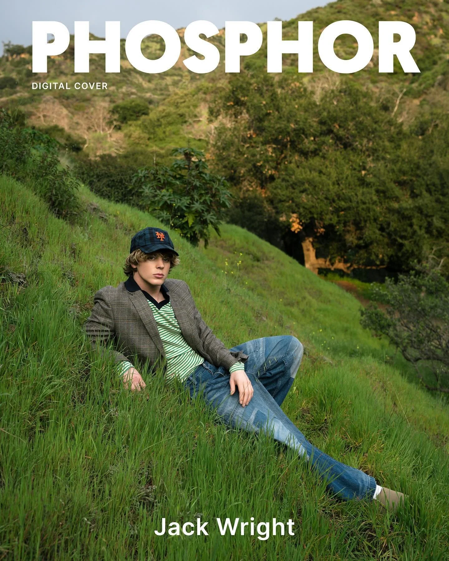 Young man sitting on a grassy hillside with trees and hills in the background, wearing a plaid blazer, striped shirt, jeans, and a green cap, looking at the camera. Overlaid text reads 'PHOSPHOR', 'DIGITAL COVER', and 'Jack Wright'.