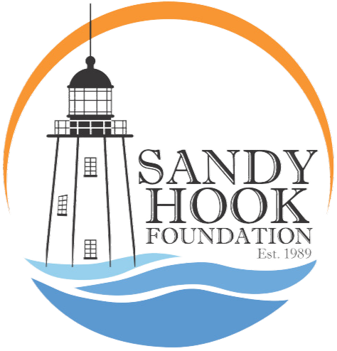 Logo of the Sandy Hook Foundation featuring a lighthouse, waves, and the foundation's name.