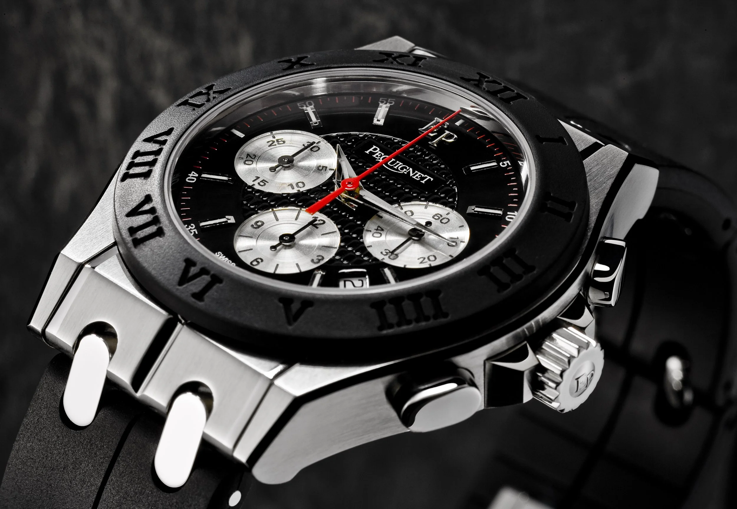 Montre PEQUIGNET avec cadran noir, sous-cadrans argentés, bracelet en métal, marque Péquignet.
