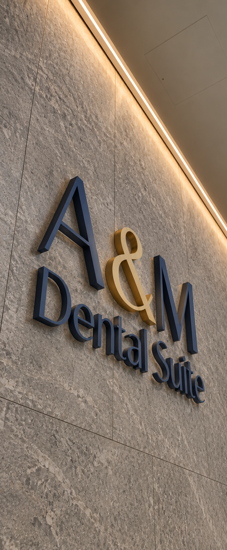 Sign for A&M Dental Suite on a beige tiled wall with ceiling lighting.