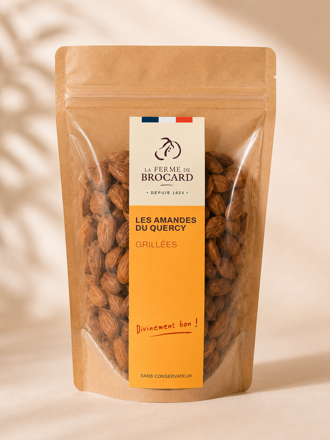 Package of roasted almonds from La Ferme de Brocard with French labeling, featuring almonds visible through the clear window.