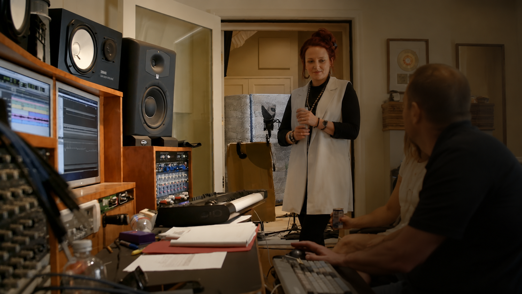 People working together in a professional music studio