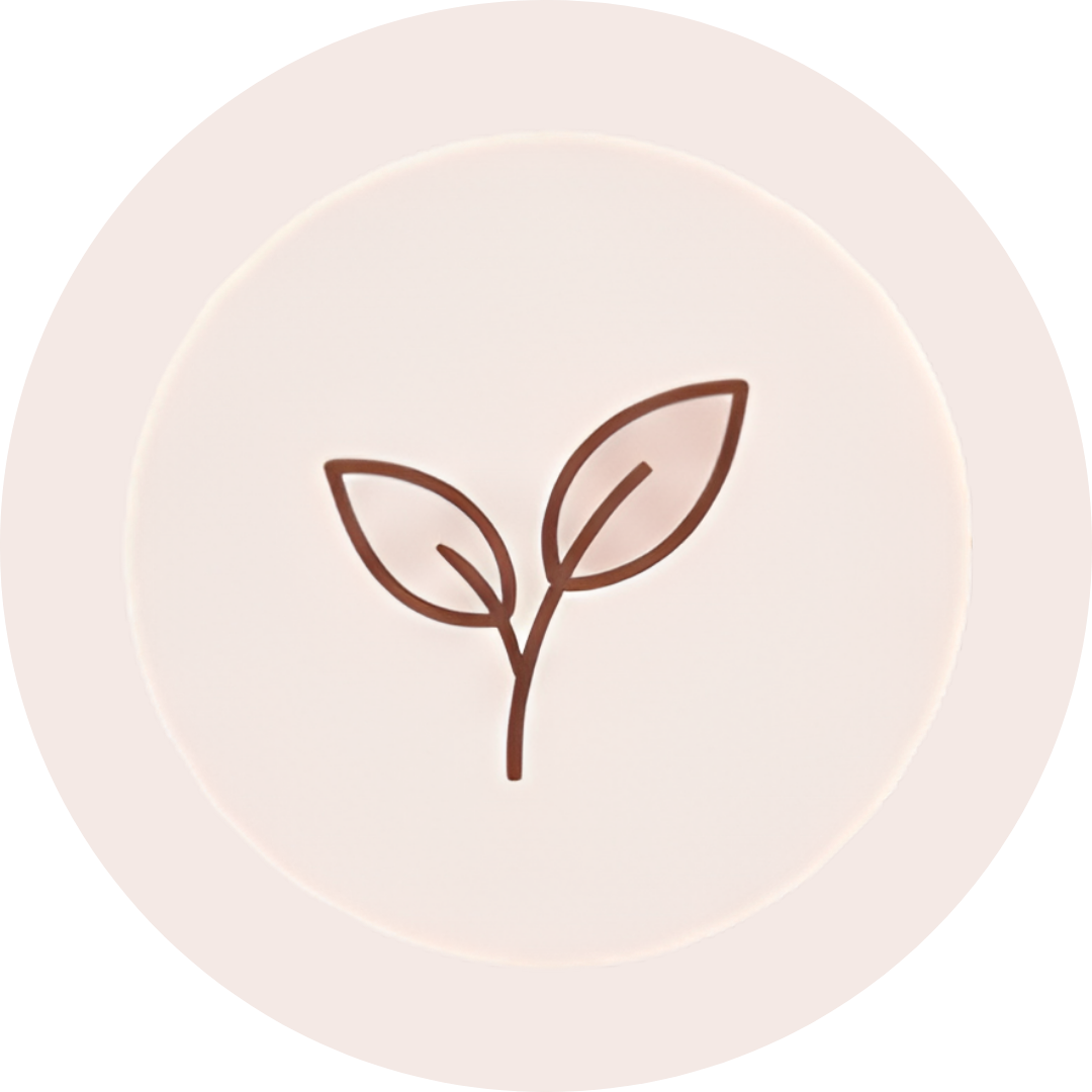 A round white token or coin with a simple line drawing of a sprouting plant with two leaves.