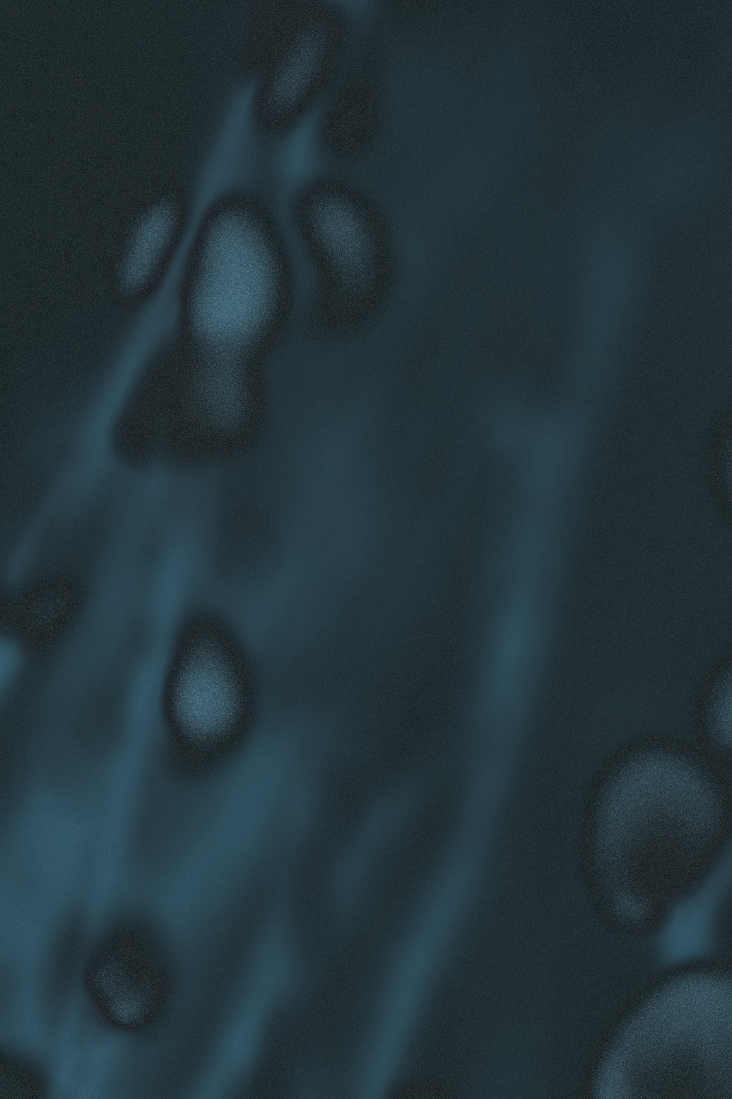 Abstract dark blue and black textured background with blurred vertical light streaks