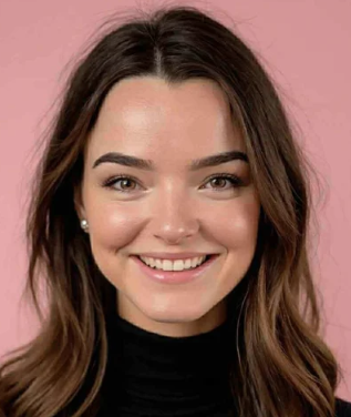Portrait of a young woman with long brown hair, smiling, against a pink background.
