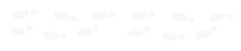 A sequence of footprints or shoeprints on a black surface, showing a trail of various sizes and orientations.