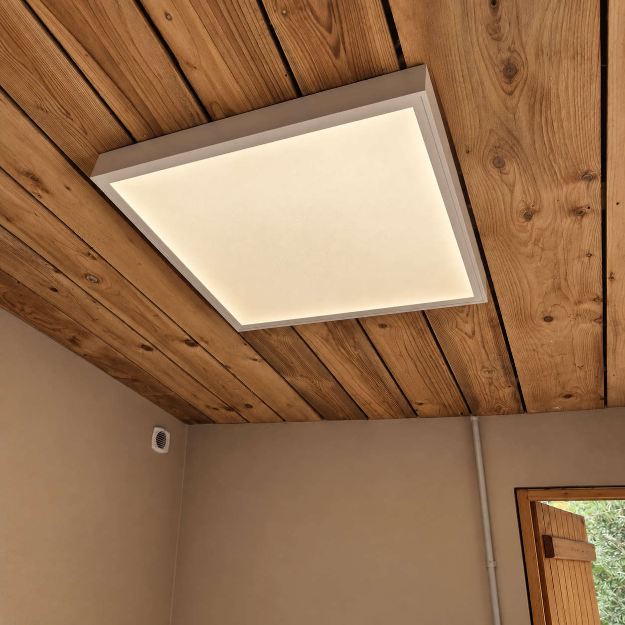 Plafonnier rectangulaire avec éclairage doux, installé sur un plafond en bois naturel.