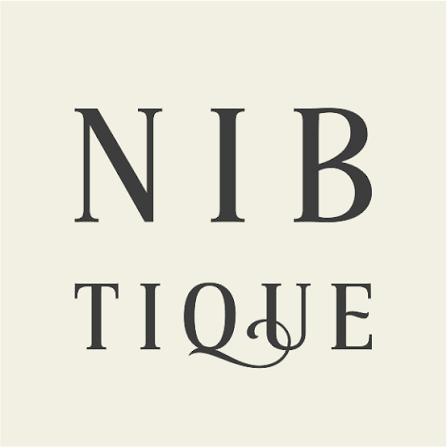 An artistic text design with the words "NIB TIQUE" arranged vertically, featuring a stylized font and a decorative flourish.