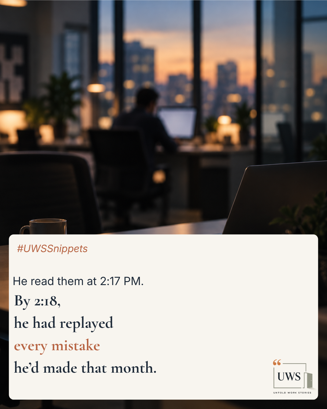 An office with a person working at a desk near large windows showing a city skyline at sunset; the scene is blurred.