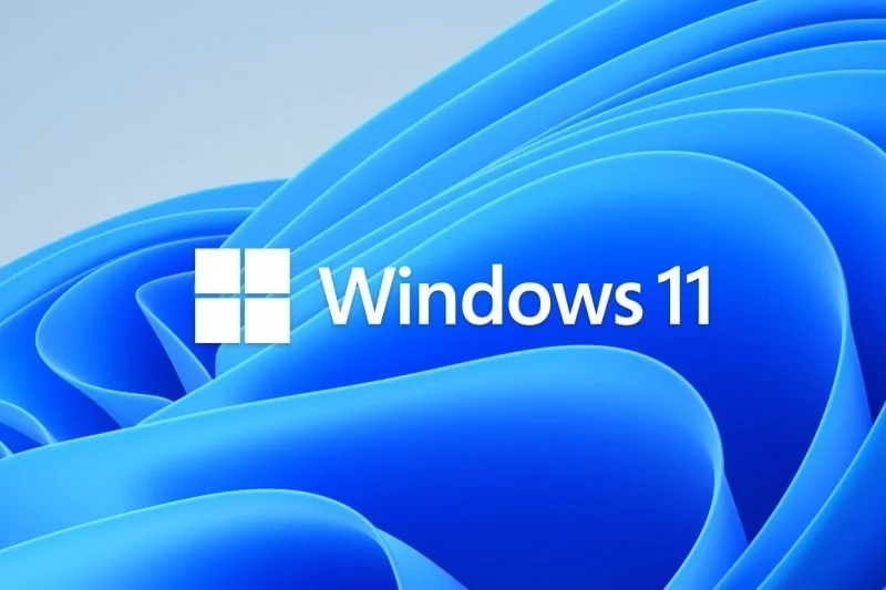 Windows 11 logo with a blue, abstract, layered background.