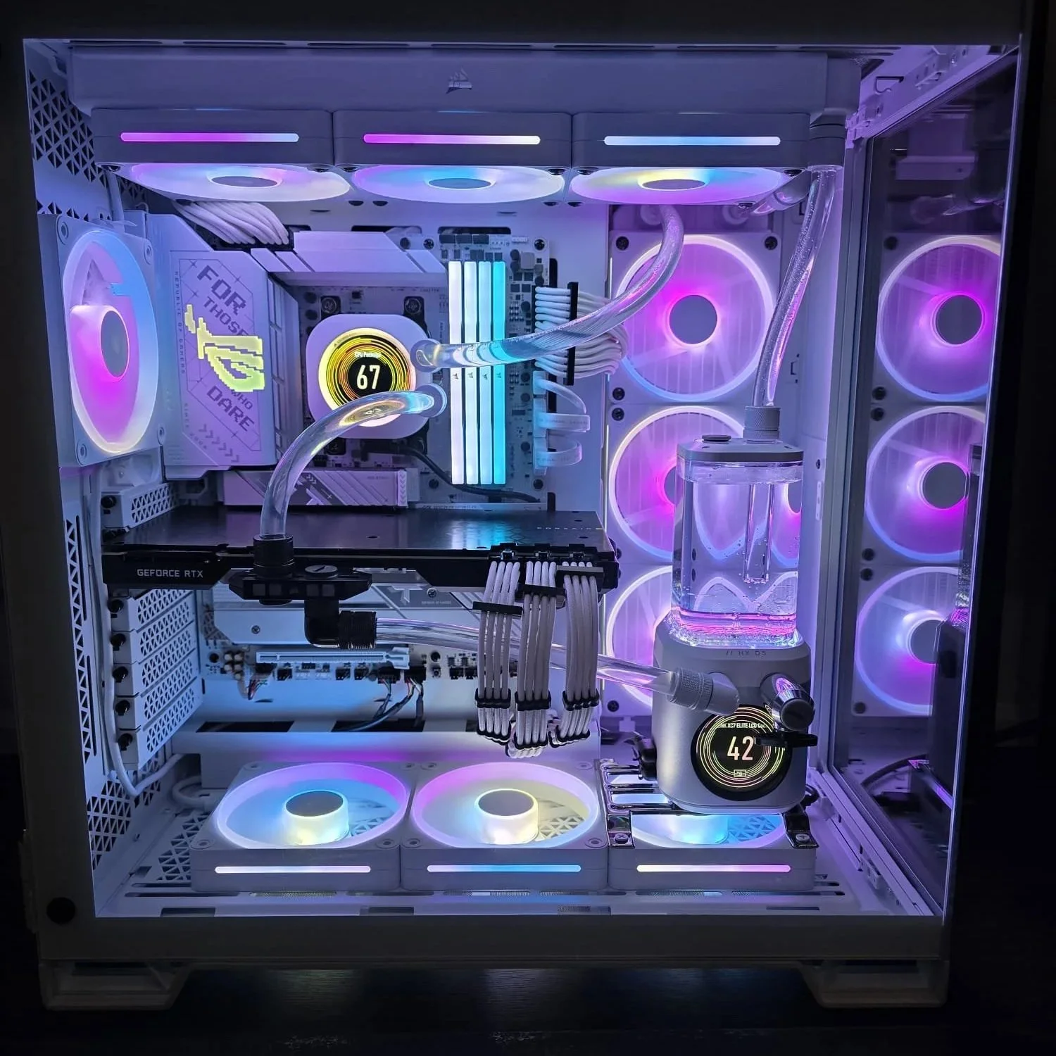 A custom-built gaming PC with a white case and RGB lighting, featuring multiple fans, a water cooling system, and a graphics card.