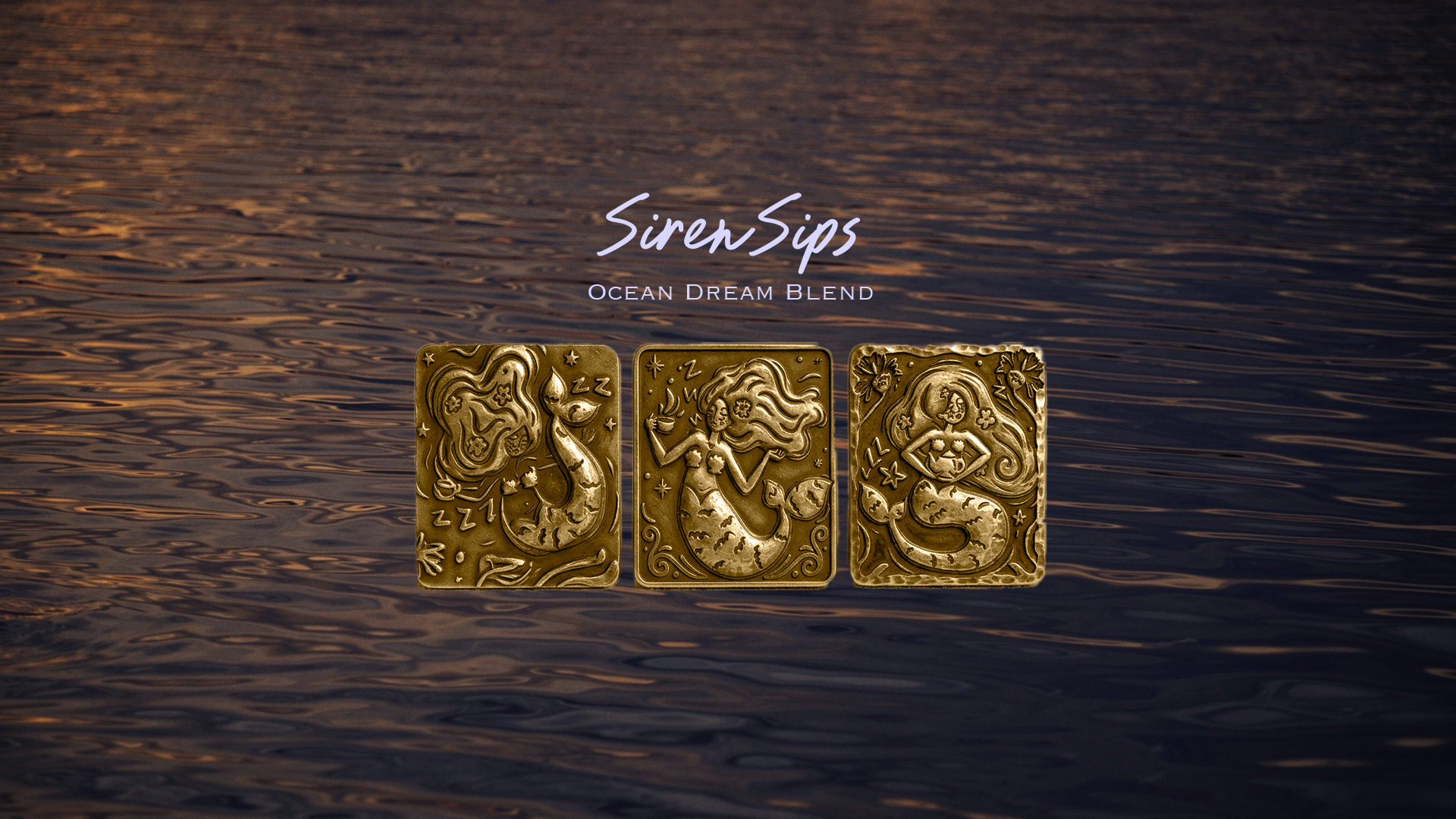 The image features three golden sea-themed metal charms resembling mermaids, set against a background of a calm ocean with a sunset reflecting on the water. The charms are decorated with intricate details of mermaids with flowing hair and ocean motif