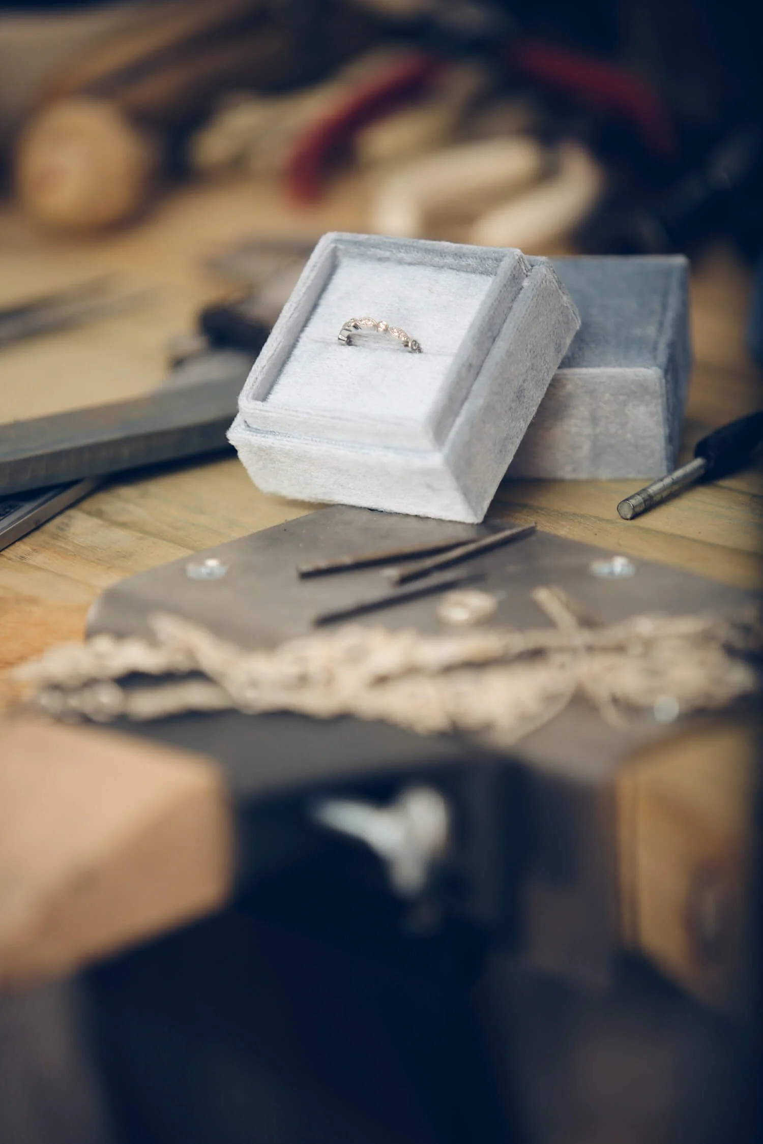 Jewellery-designer-finished-ring-on-workbench.jpg