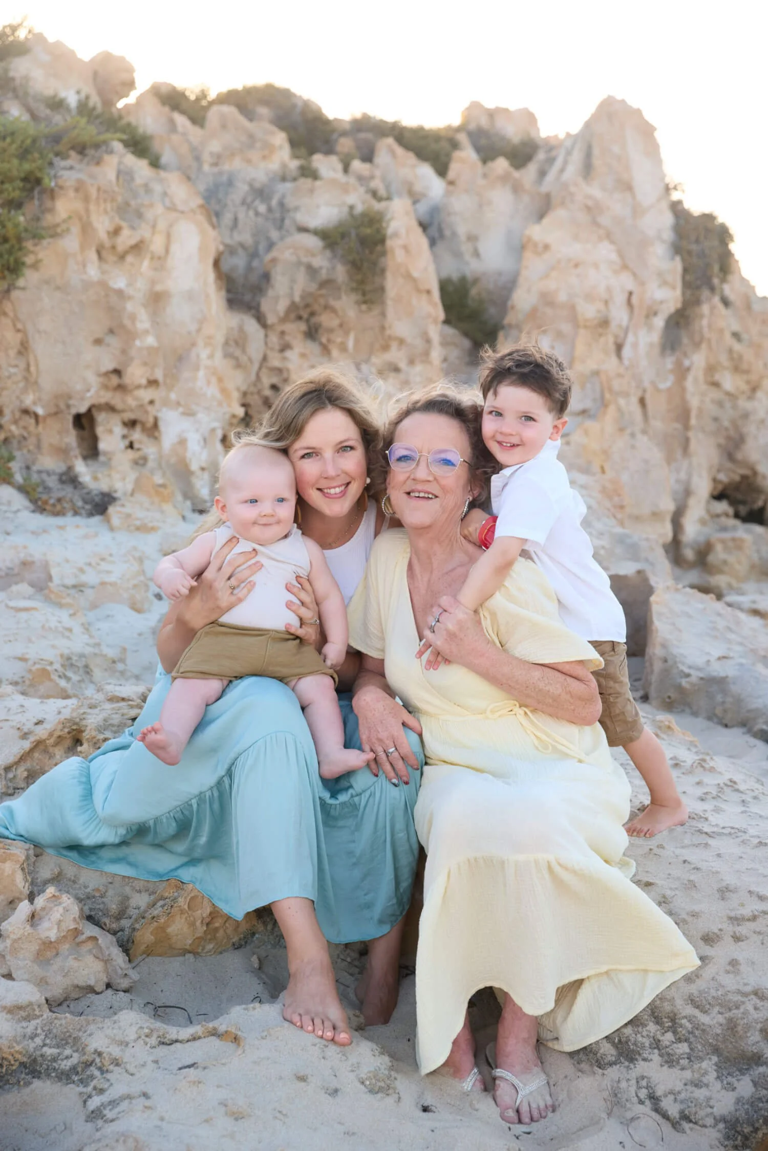 Grandmother-with-her-Daughter-and-Grandkids-sitting-on-Rockformation-at-Trigg-Island.jpg
