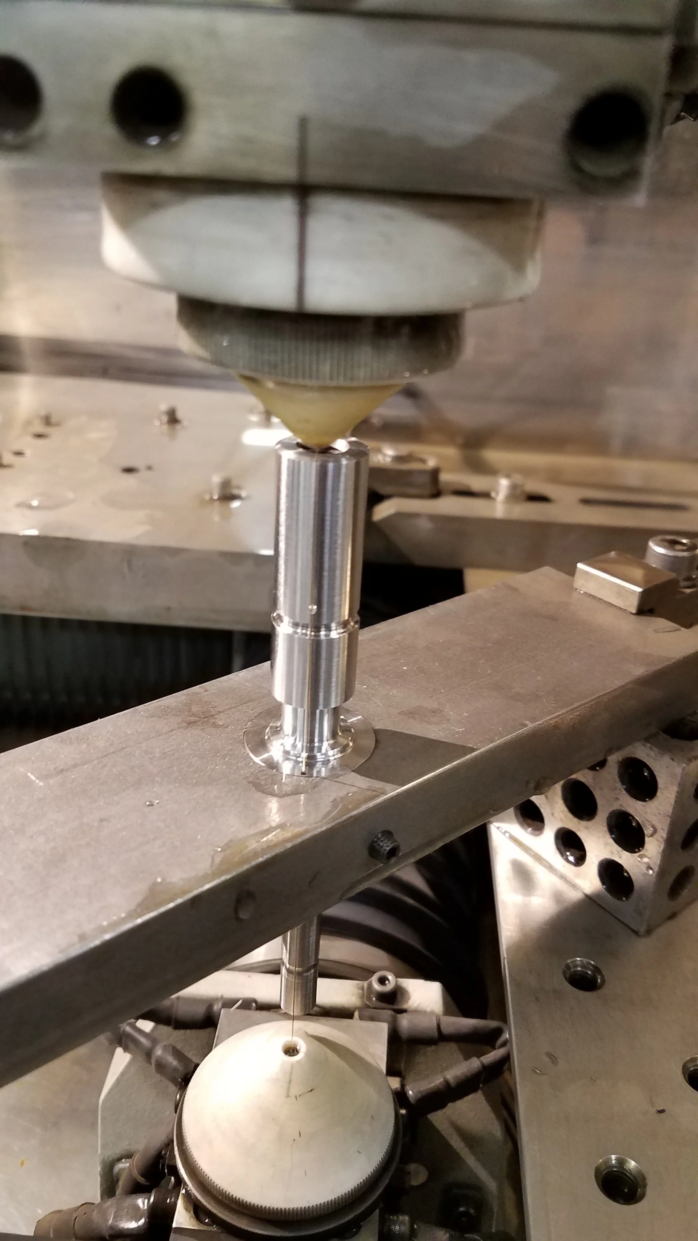 Wire EDM ready to cut gears on core to be threaded next.