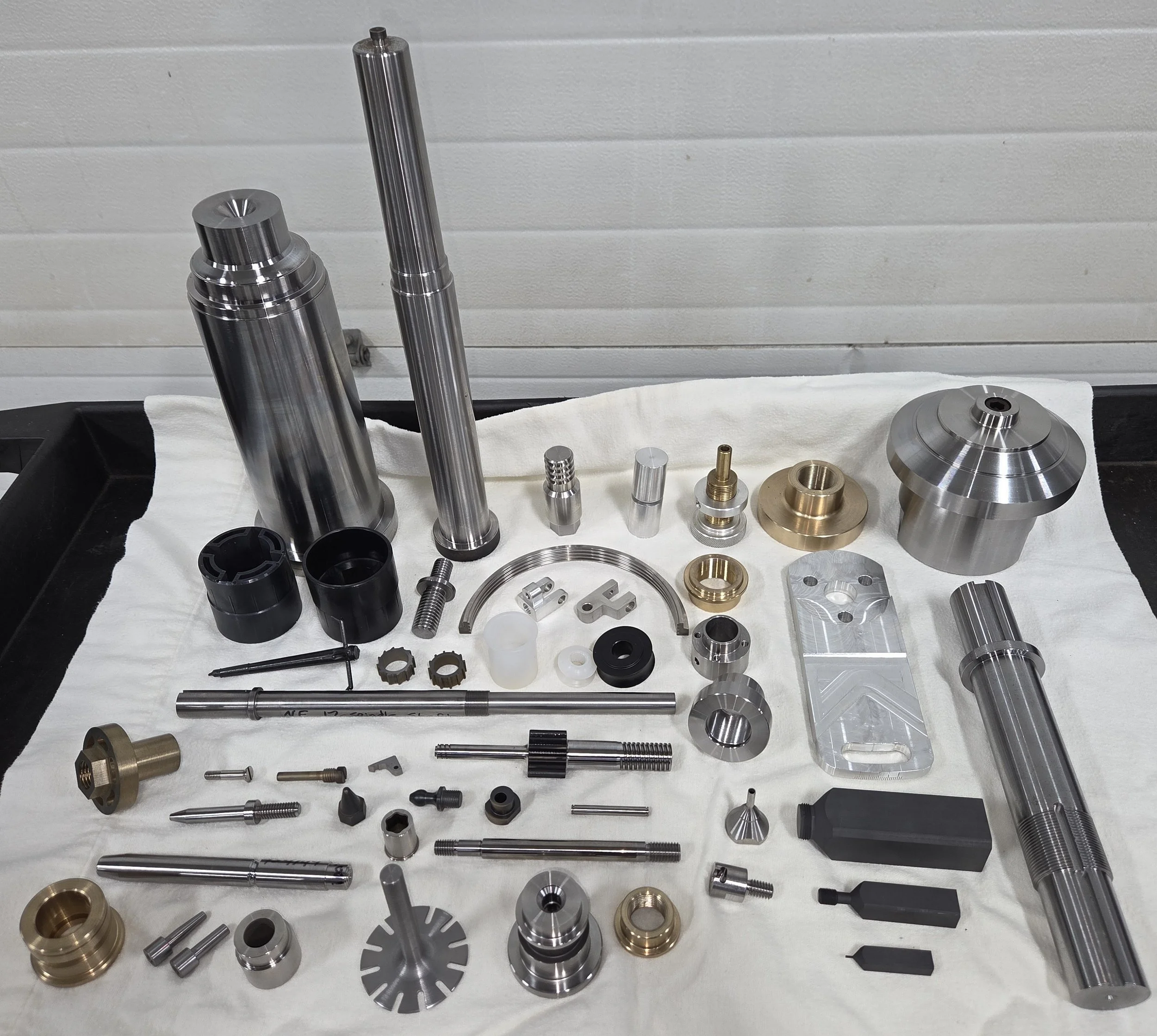 Assortment of mold & die components, parts for automated machines, threaded electrodes, custom cutter, custom fasteners.  Just a few of the many products manufactured at Becker Machine & Tool, LLC.