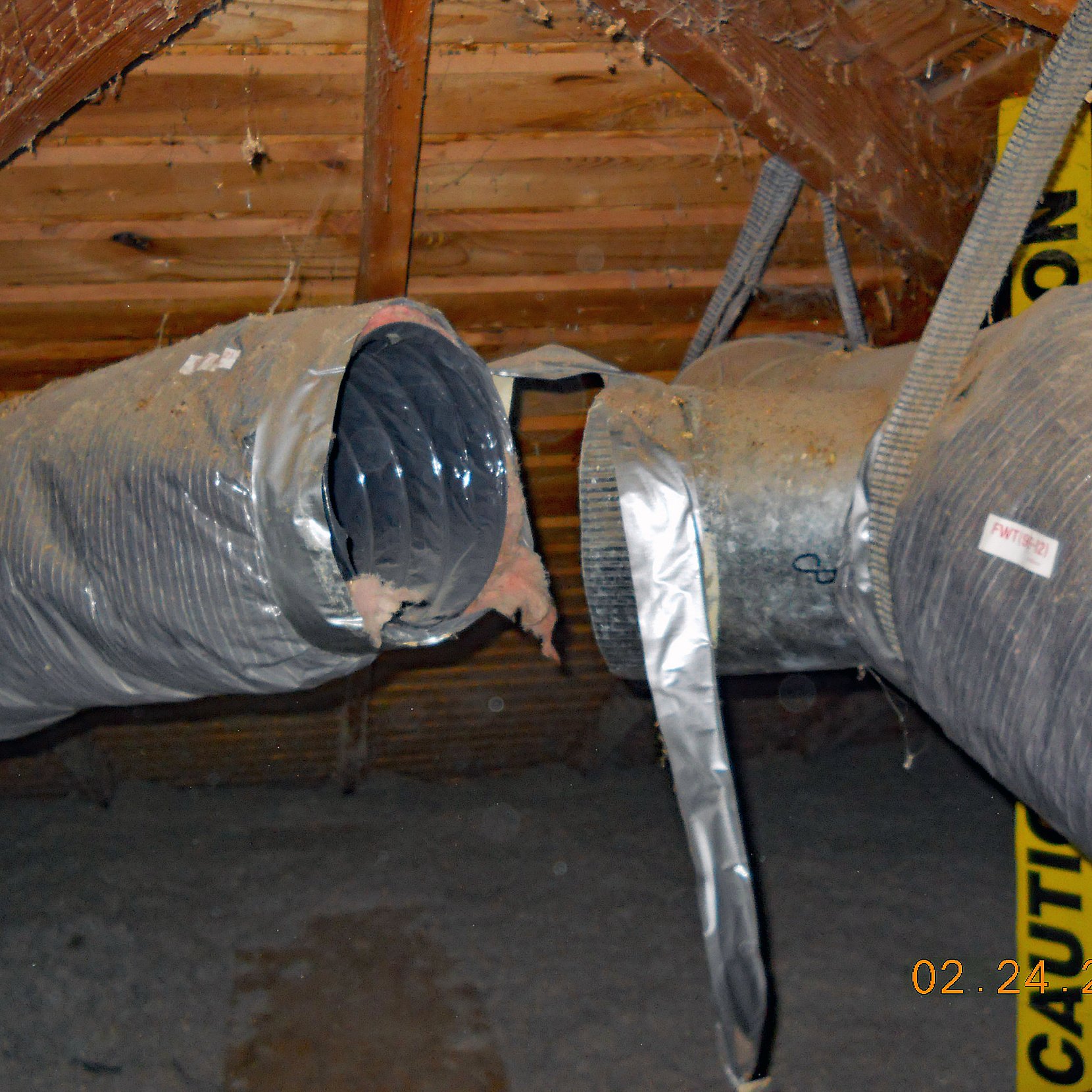 Large heating venting and air conditioning HVAC return air duct disconnected and separated in an attic space found during a home inspection.