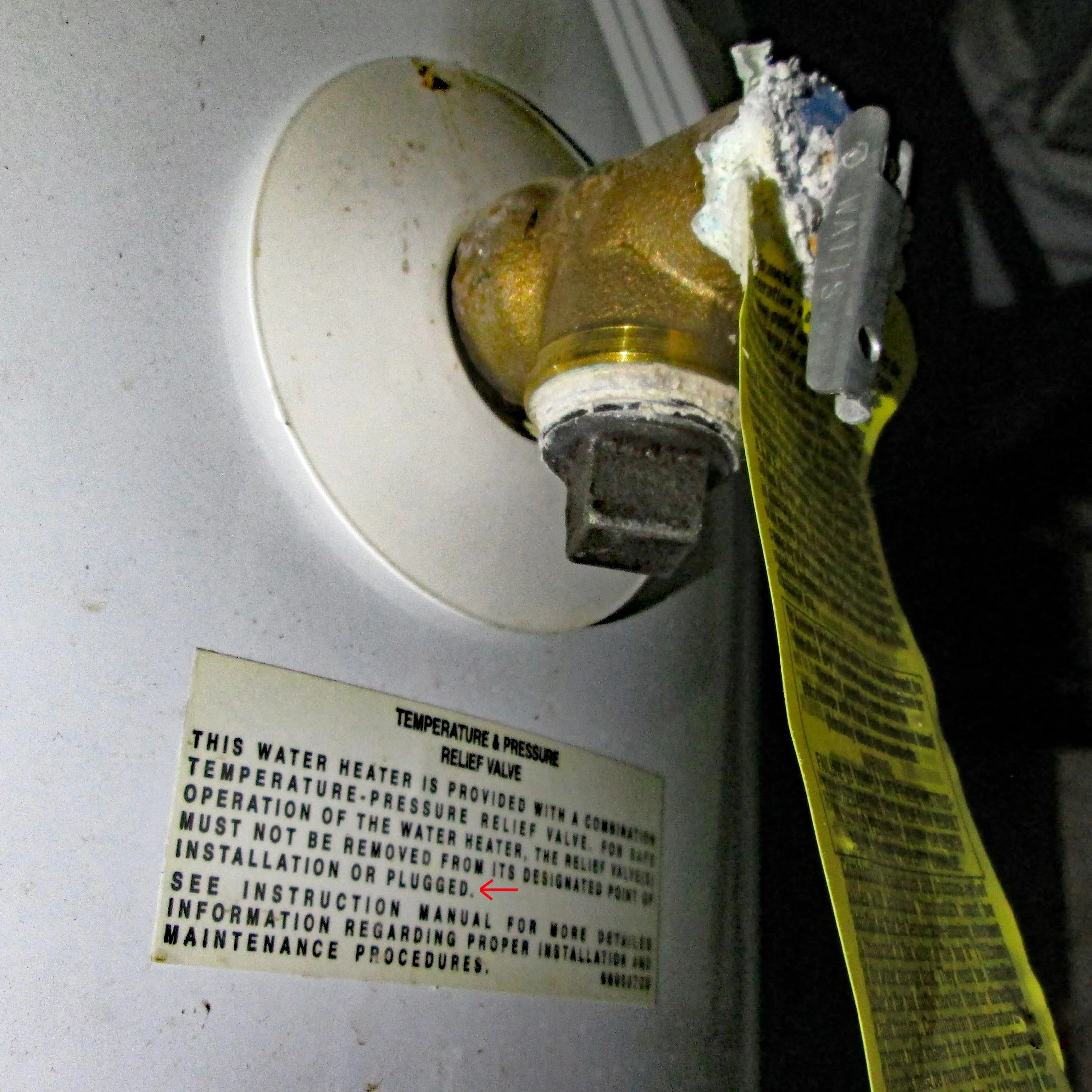 A water heater temperature and pressure relief valve improperly and hazardously plugged to prevent proper and safe operation found during a home inspection.