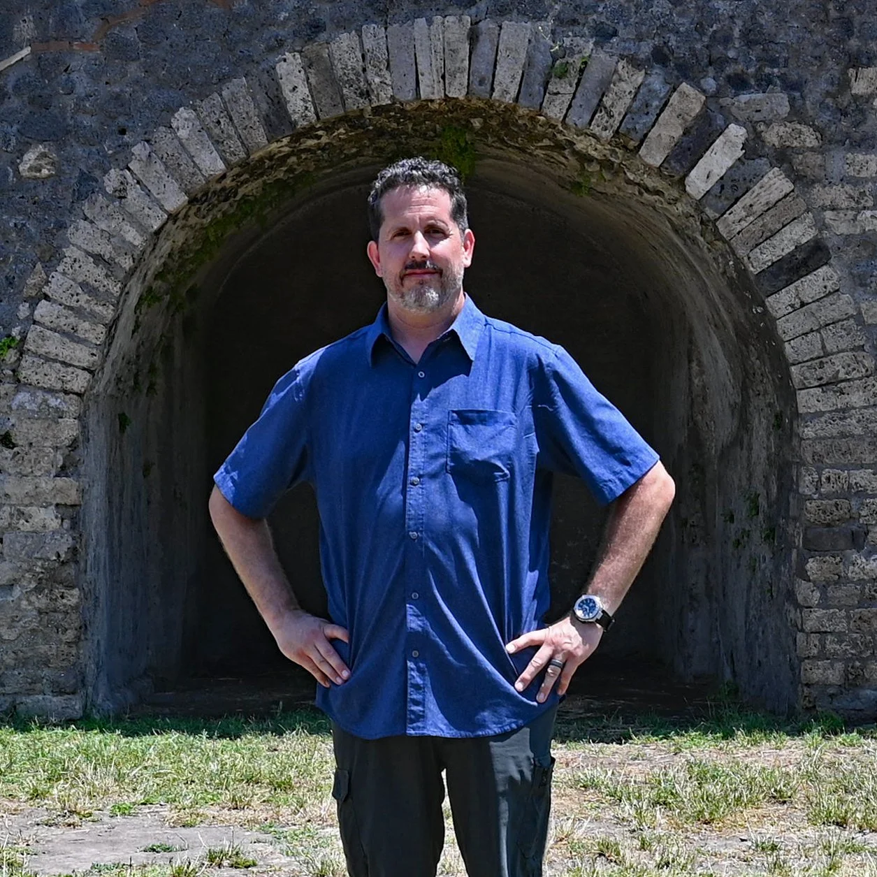 Jeff Worsham of Archstone Home Inspections standing in front of a Roman stone arch.