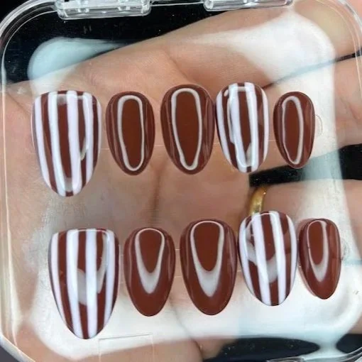 Press-on nails with white and brown striped and solid brown designs