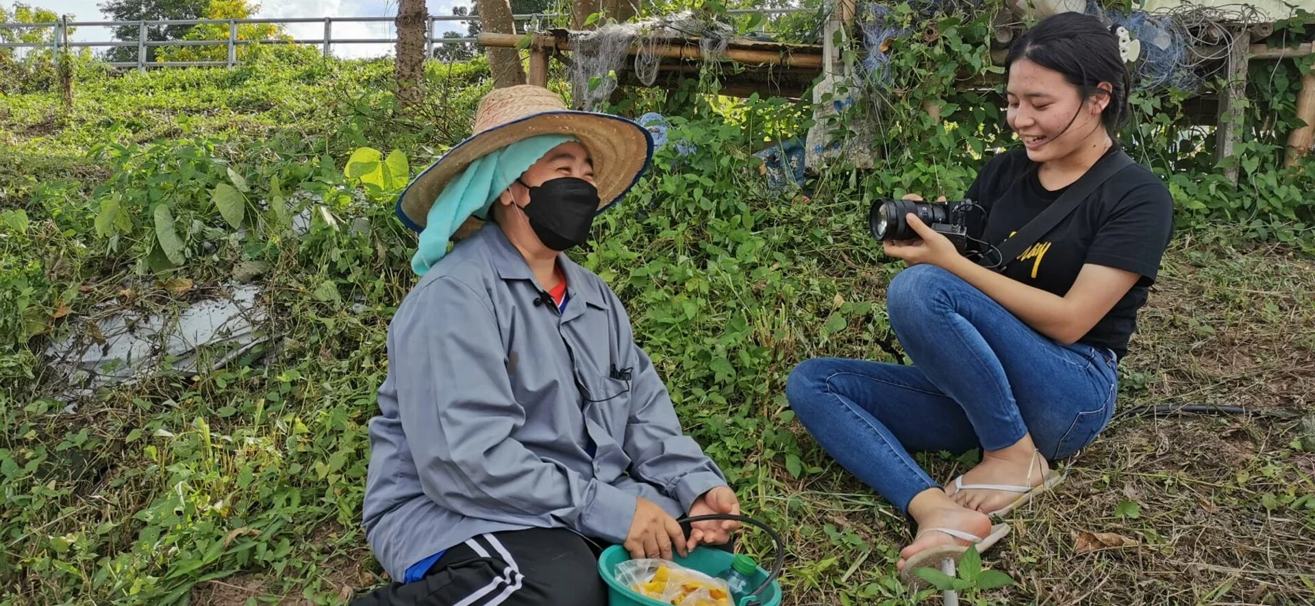 ploythida-participant-interviewing-a-gold-panner-on-a-banks-of-the-mekong.webp
