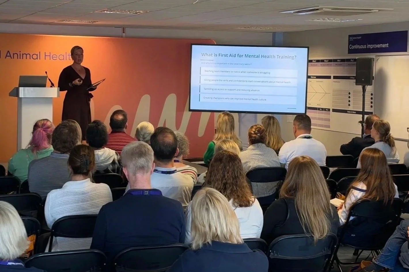 Sarah Knight speaking to leaders at an industry event