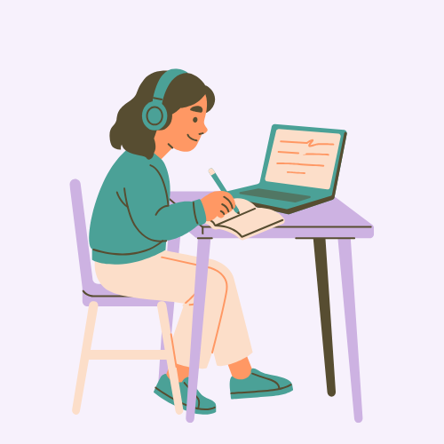 A woman with headphones sitting at a desk, writing in a notebook while working on a laptop.
