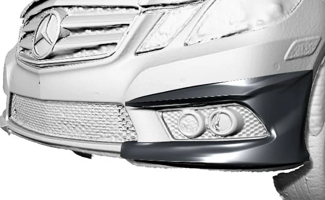 Close-up of the front bumper and grille of a silver Mercedes-Benz vehicle