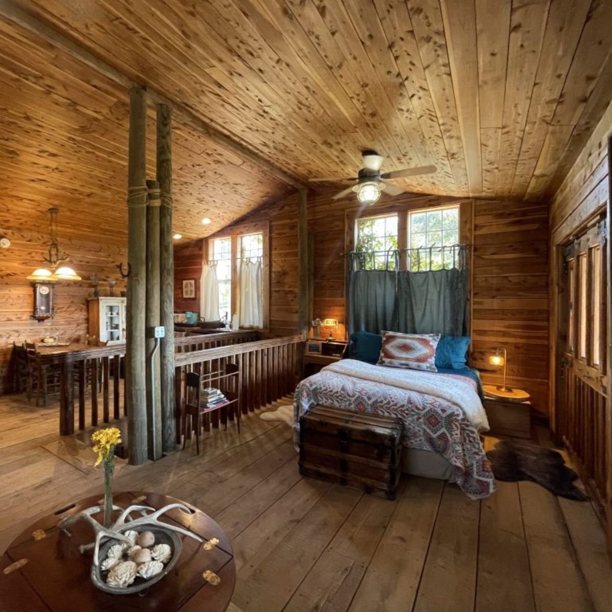Overlook Suite with a queen bed, cedar ceiling, and a spacious ranch-style interior