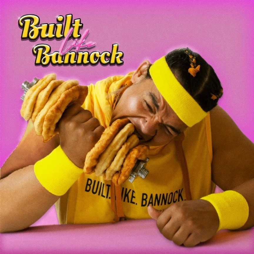 Man wearing yellow sports gear biting into a Bannock Dumbbell, against a pink background with the text 'Built like Bannock' in a bold yellow and pink font.
