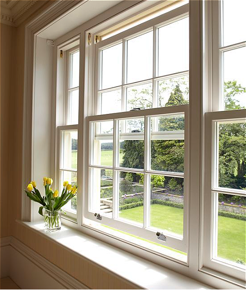 Wood windows with divided-light grids, illustrative image
