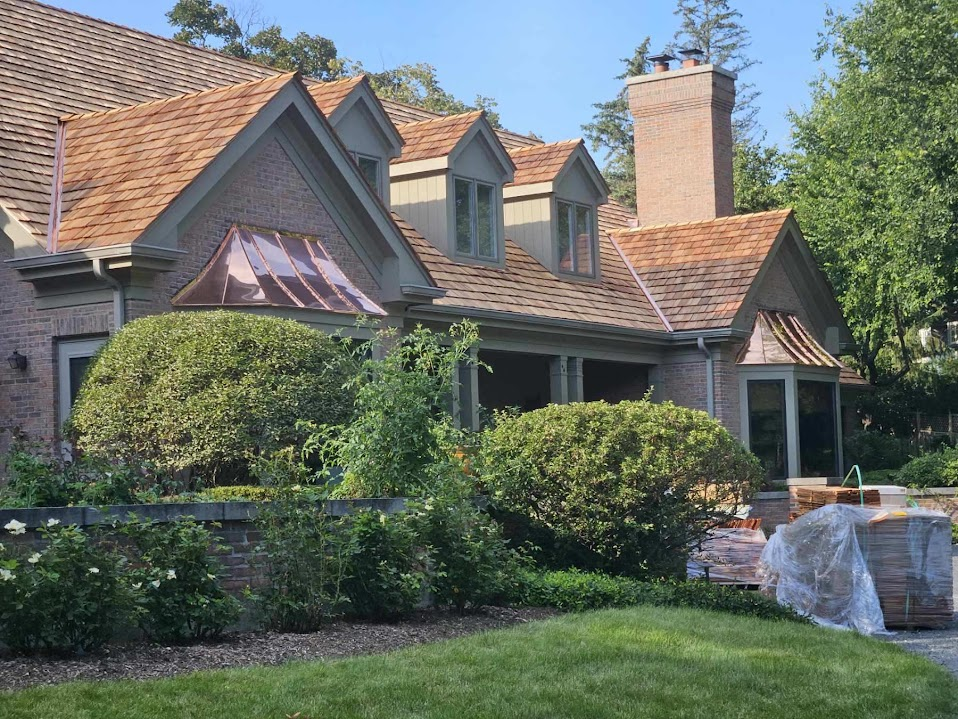 Cedar roofing and custom copper work completed by Upside Exteriors in Chicagoland