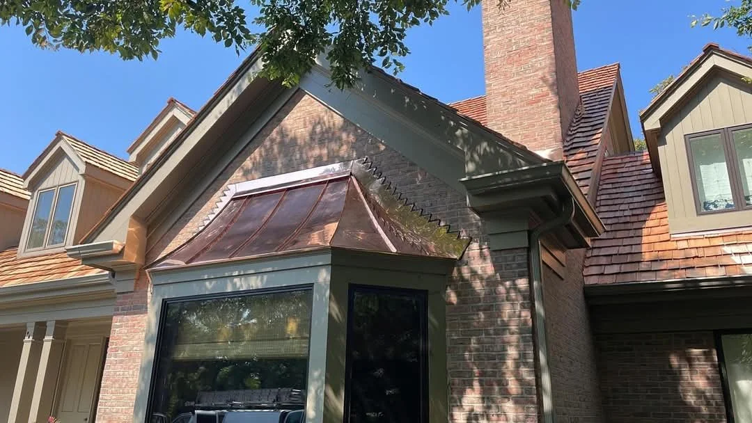 Cedar shake roofing with copper roof details