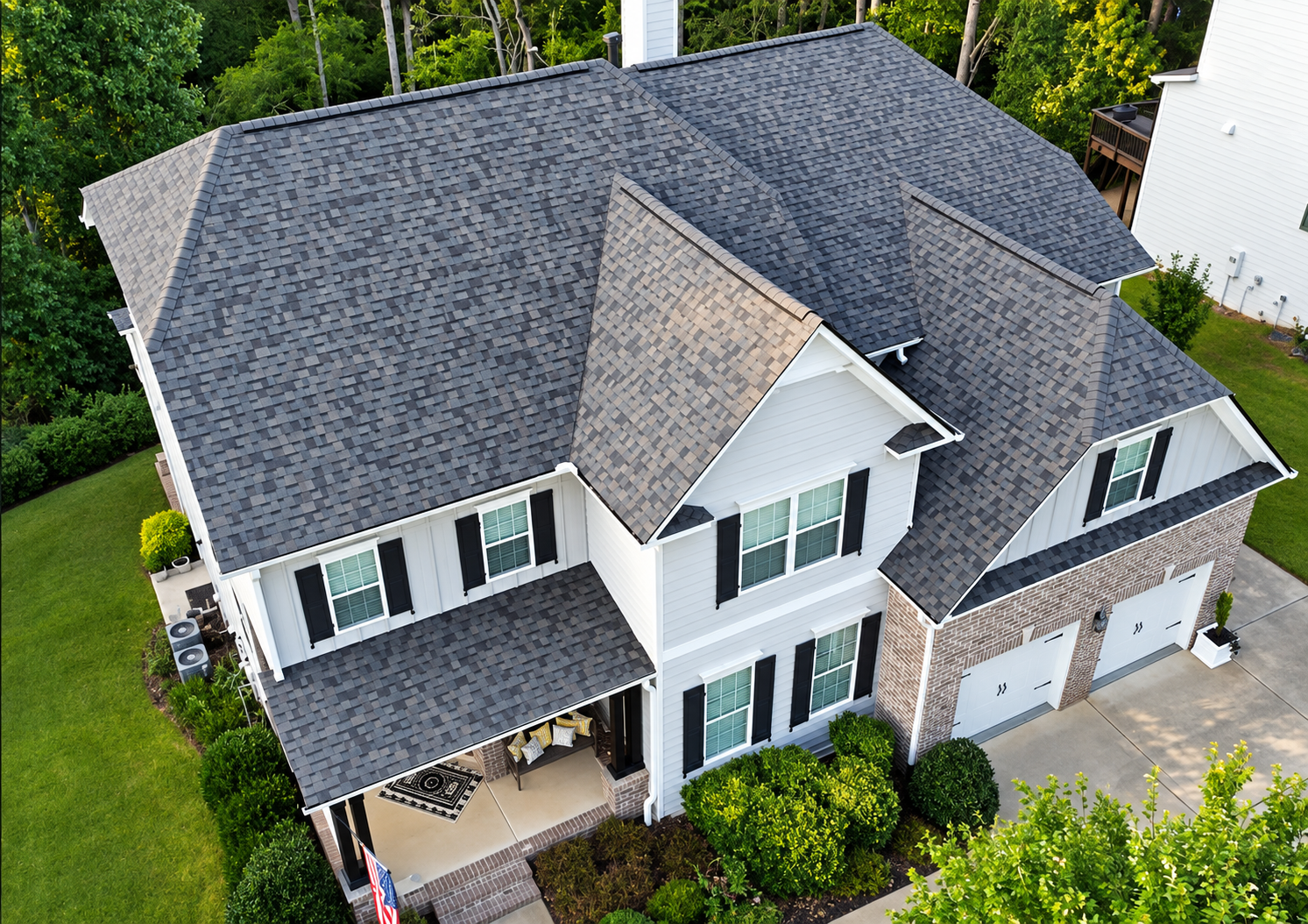 Aerial view of a completed gray architectural shingle roof on a Chicagoland home
