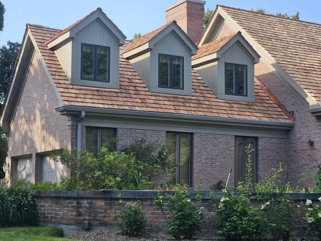 Completed cedar shake roof with copper details