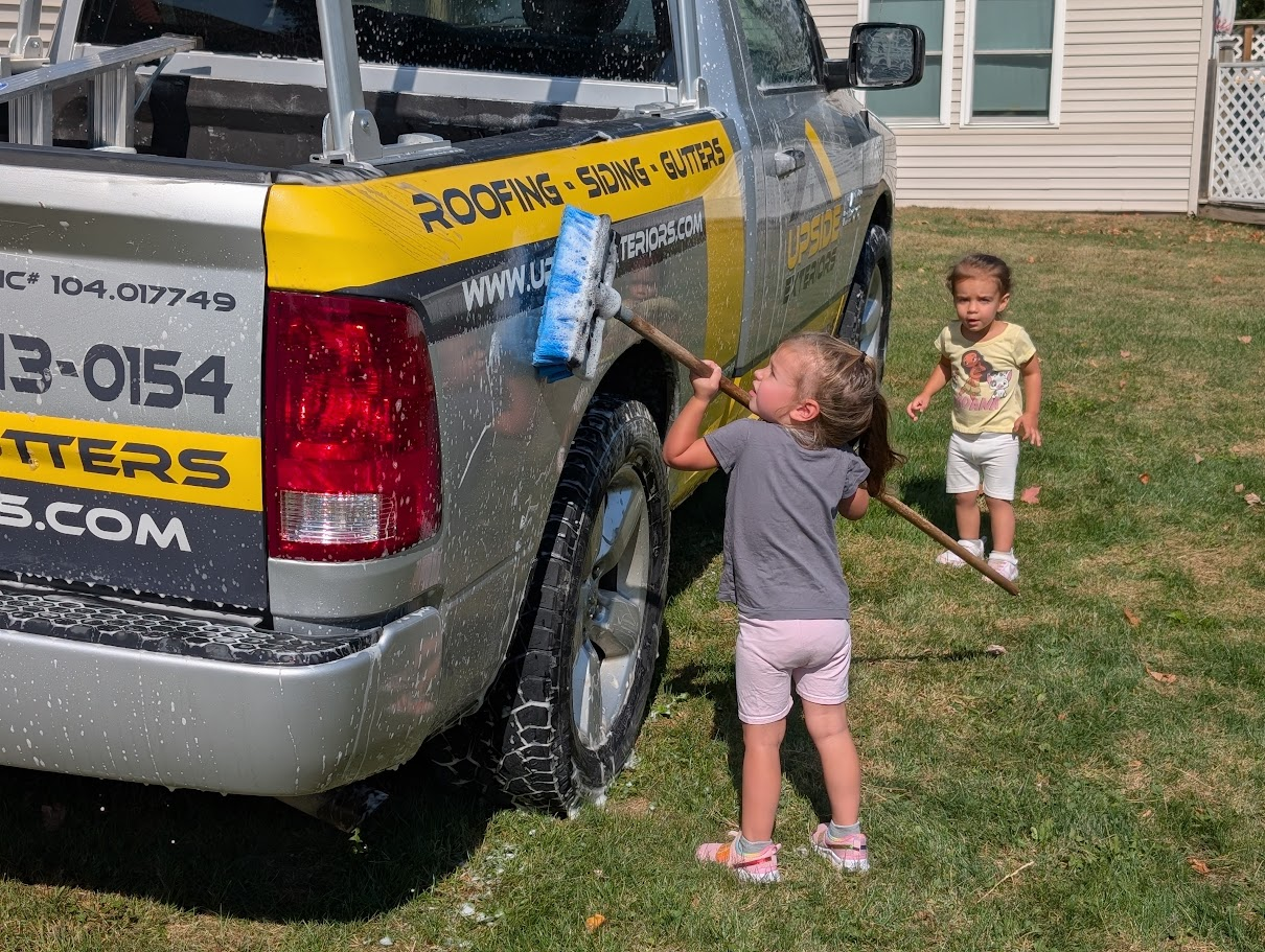 Our full-size Upside Exteriors truck and the little crew’s matching truck—a family business from one generation to the next.