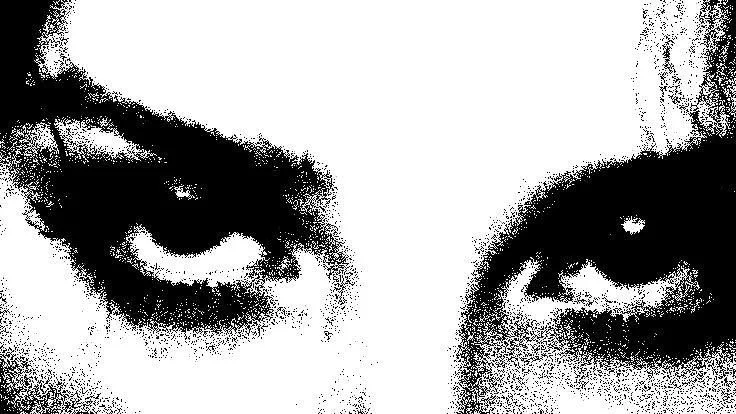 Close-up of a person's eyes with intense gaze.