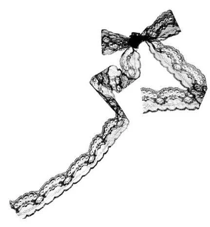 Lace bow with long lace tail.
